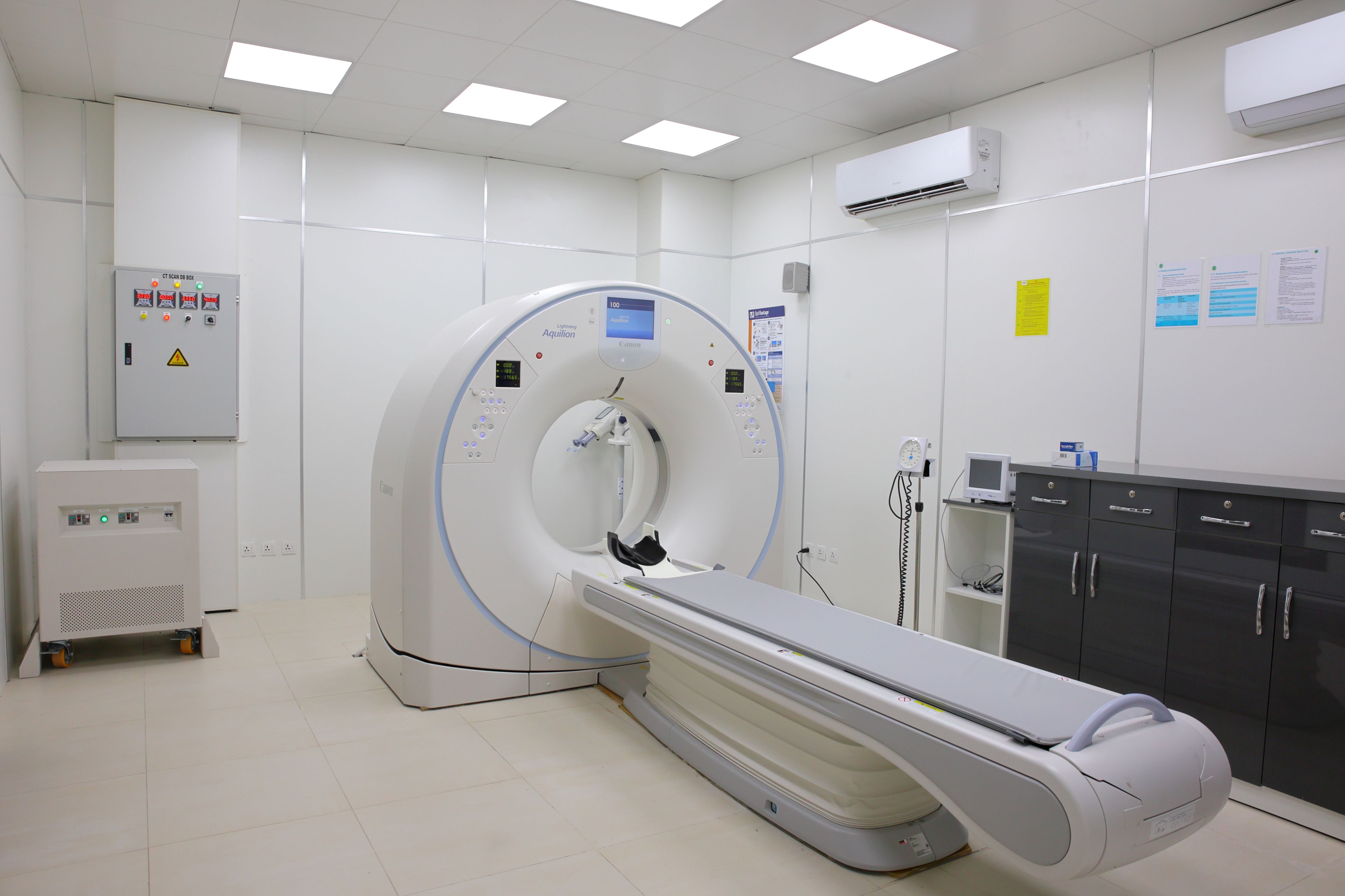 Medical imaging specialist reviewing radiation therapy scans